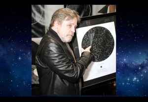 Mark Hamill holding his My Sky Moment map